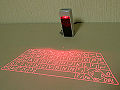 Madoka's keyboard is similar to this commercially available Laser Keyboard.