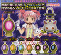 Bandai Soul Gem Light, regular versions for all five girls and impurity versions for Madoka, Homura and Sayaka