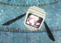 The monitor shows Mami wiping away her tears