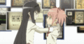 Homura gives Madoka a hug.