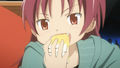 Kyoko eating some of Mami's cake in Episode 12